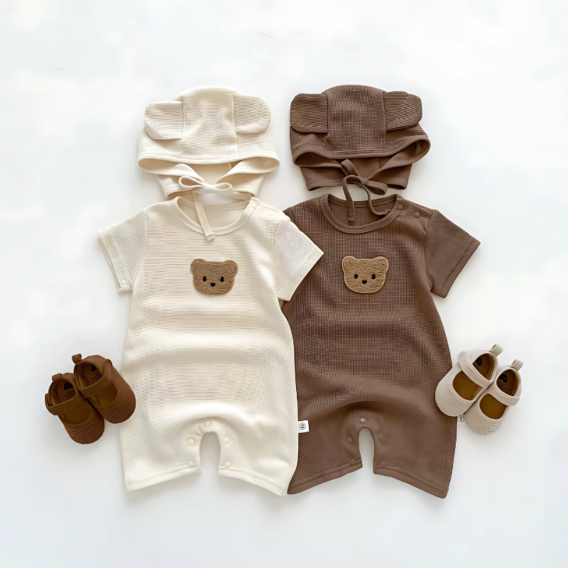 2 Brown Baby Romper and hat sets with shoes, one beige and one brown on a white background