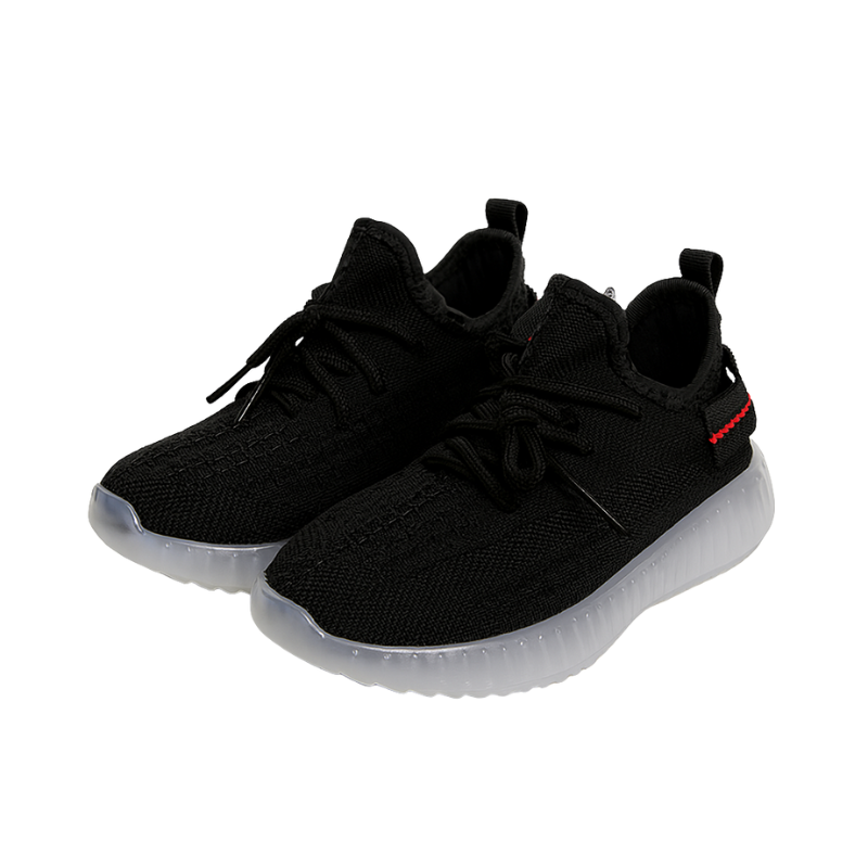 Black coloured knit sneakers on a white background