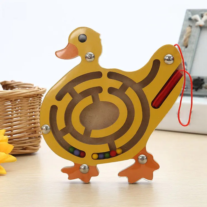 Wooden duck maze toy on a light surface with a basket in the background
