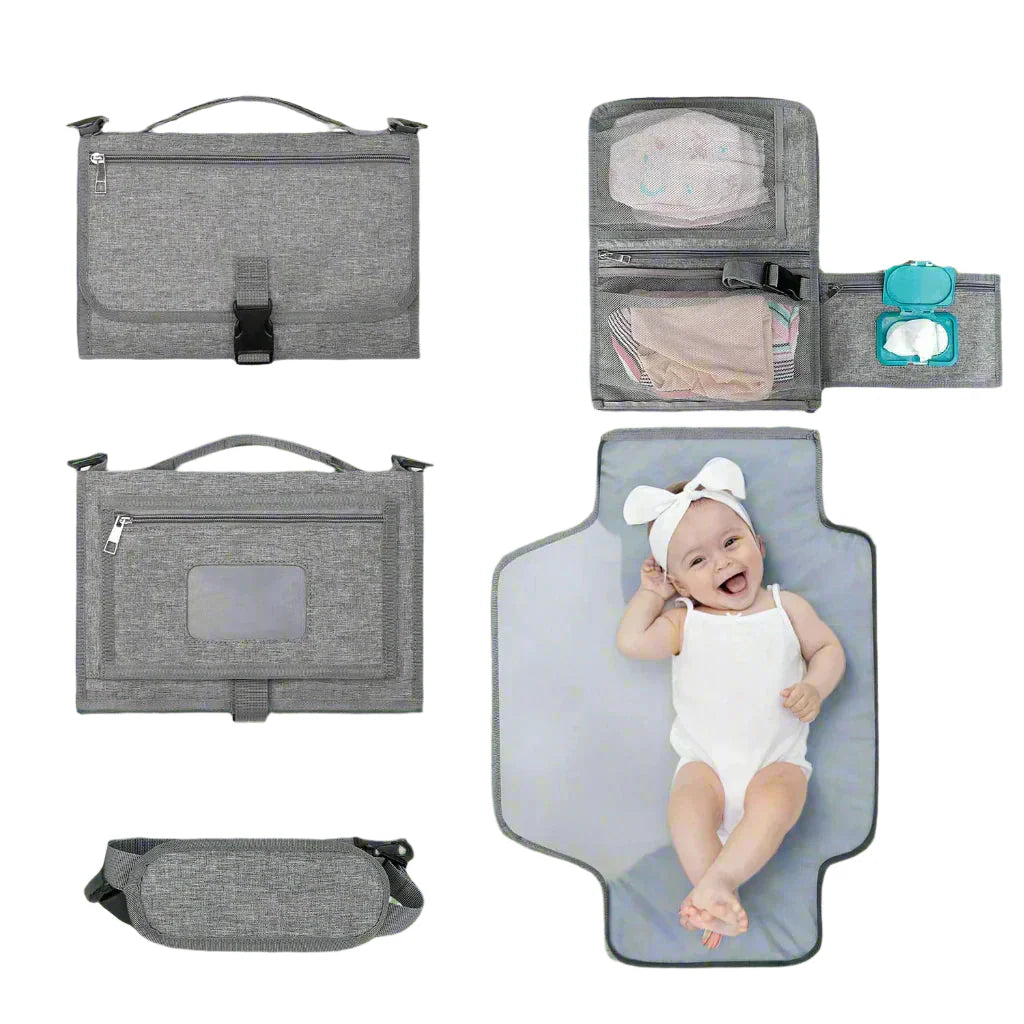 Gray baby diaper changing bag with multiple compartments and a baby on a changing pad.