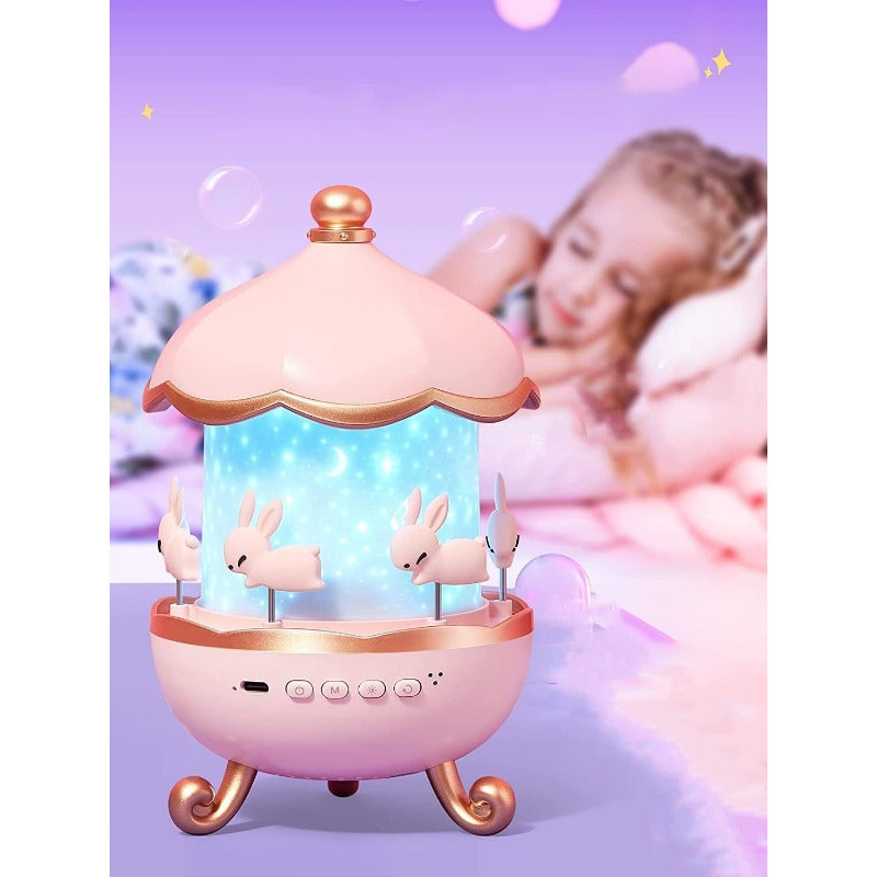 Pink carousel toy with rabbits on a purple background