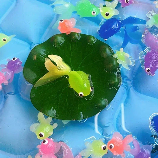 Colorful fish toys on a blue background