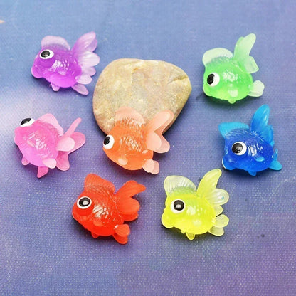 Colorful fish-shaped toys on a blue background