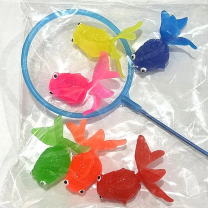 Colorful plastic fish toys with a blue net on a white background