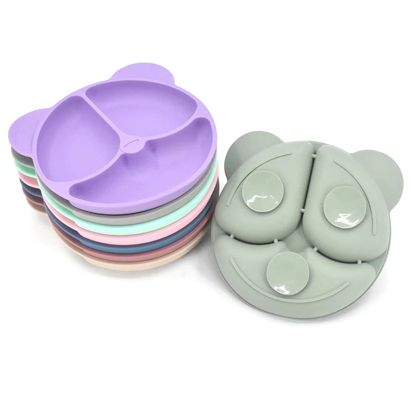 Stack of colorful silicone placemats and a green silicone product on a white background