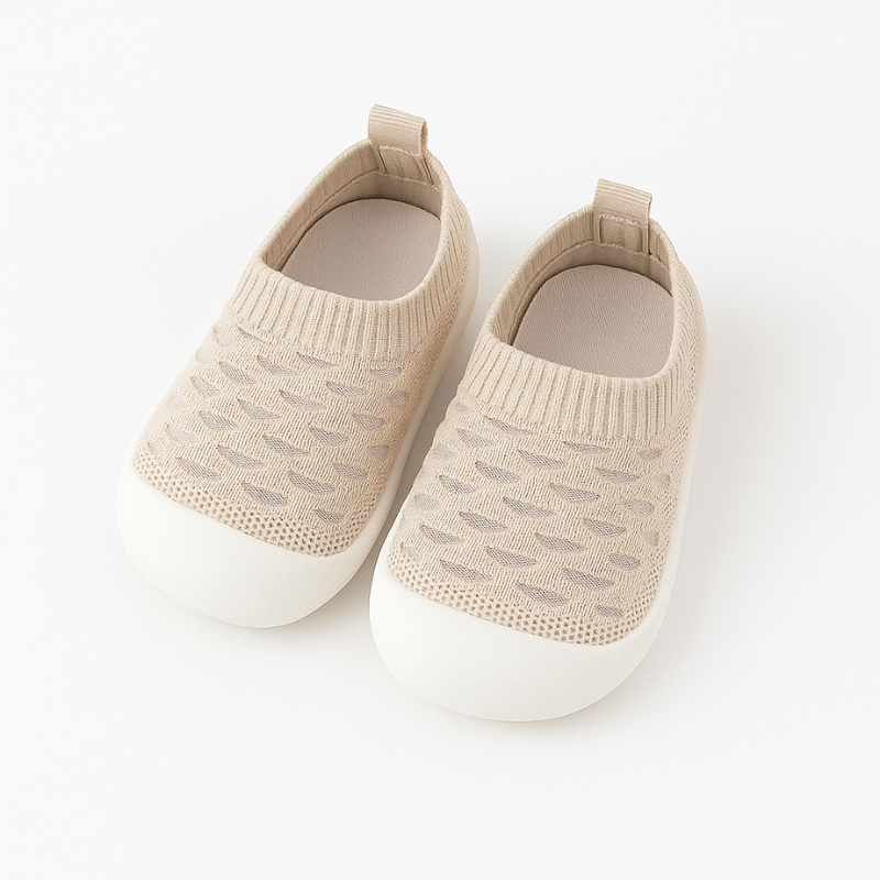 brown knit baby shoes on a white background