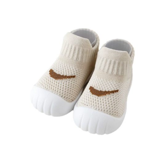 beige colored shoe sock on a white background