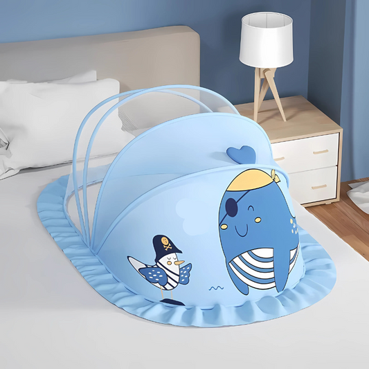 Light blue NapCloud mosquito net displayed open on a bed, highlighting its whale design and spacious interior.