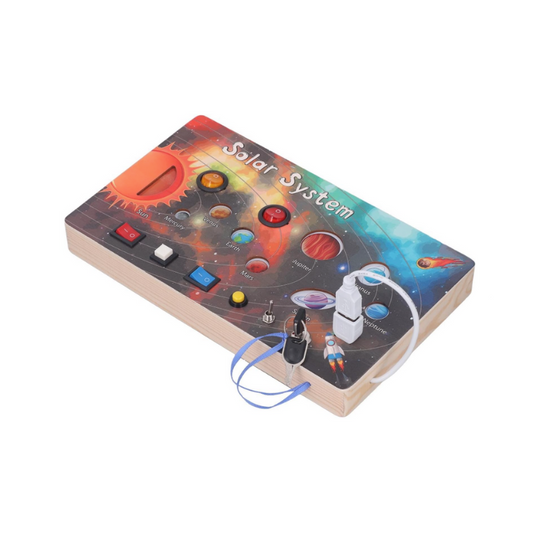 Model of the solar system on a wooden base with colorful planets and spacecraft illustration.