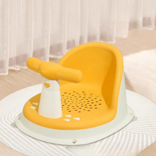 Yellow and white baby seat with handle on a light surface