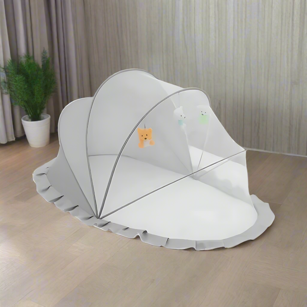 Gray NapCloud whale-themed mosquito net fully set up showcasing breathable mesh and modern neutral design.
