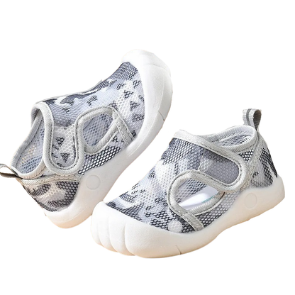 gray mesh baby shoes on a white background
