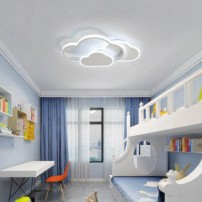 Children's room with a cloud-shaped ceiling light fixture.