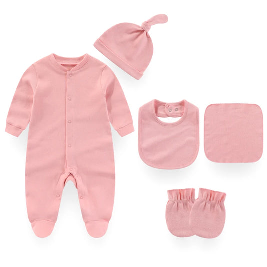 Pink baby outfit set with onesie, hat, bib, burp cloth, and mittens on a white background
