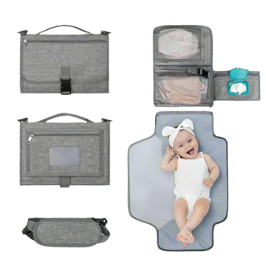 Gray baby diaper changing bag with multiple compartments and a baby on a changing pad.