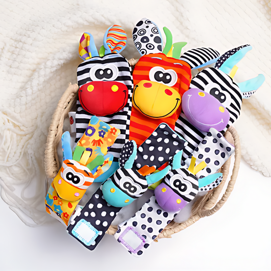 Colorful baby rattle toys with animal designs in a woven basket on a white background