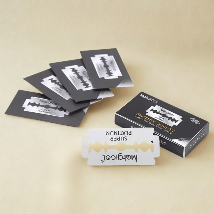 Razor blades and packaging on a beige background