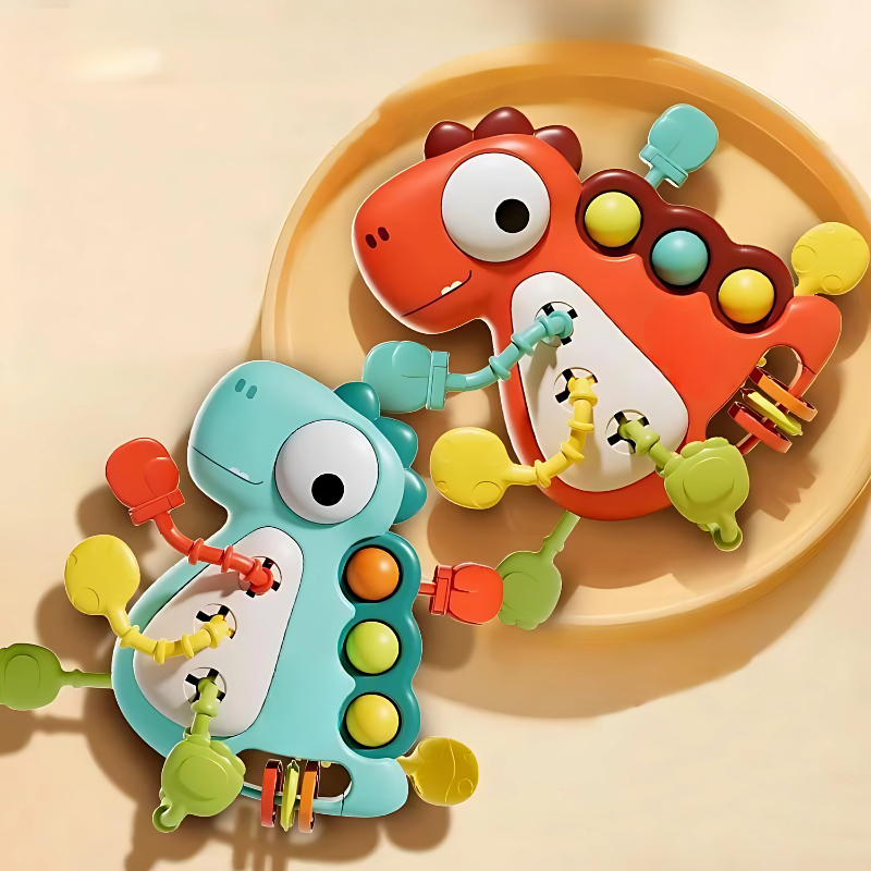 Two colorful baby teething toys on a beige plate.