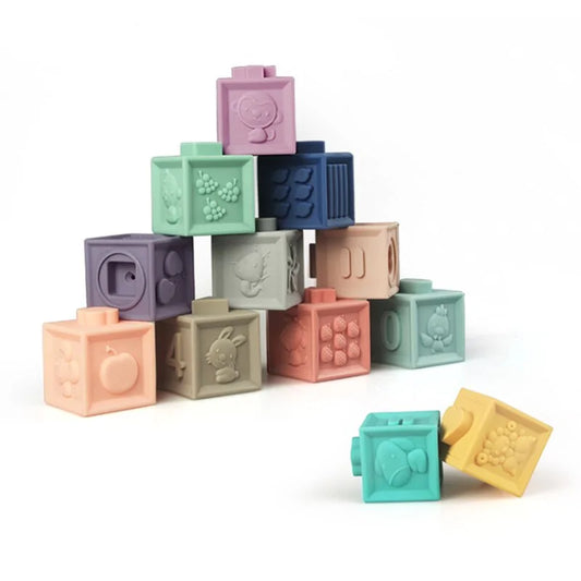 Colorful baby blocks with embossed designs on a white background