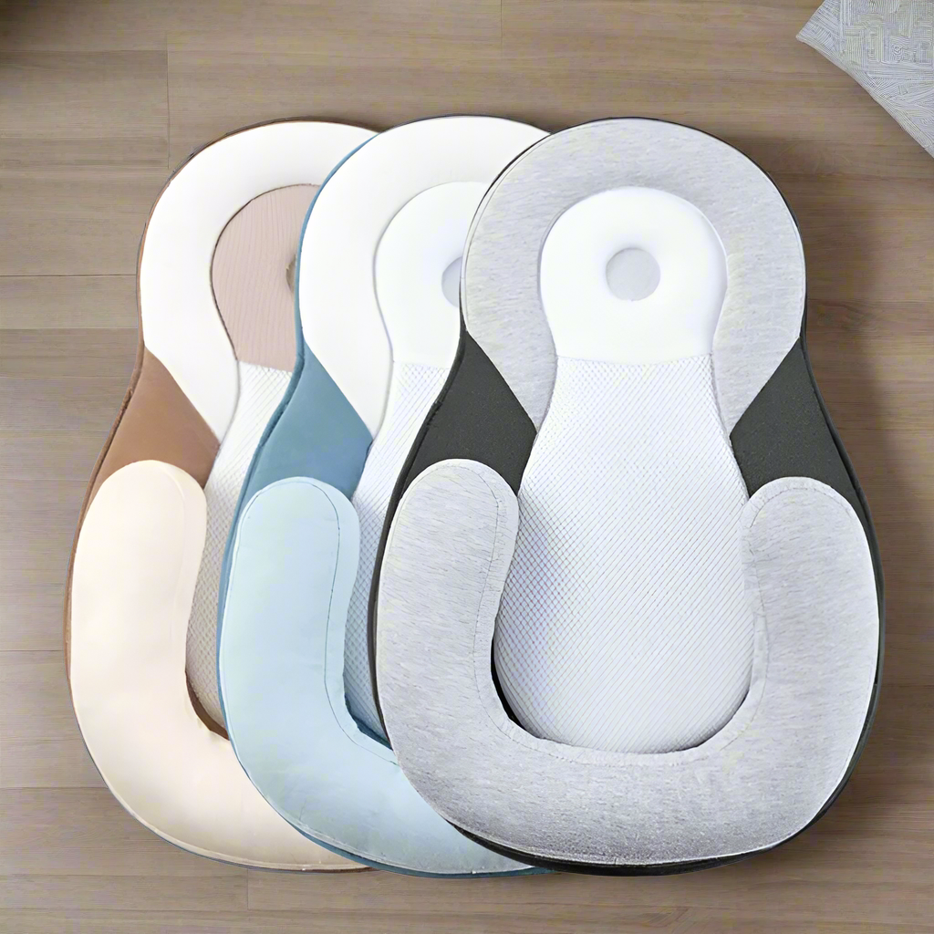 Three baby Loungers in different colors on a brown background