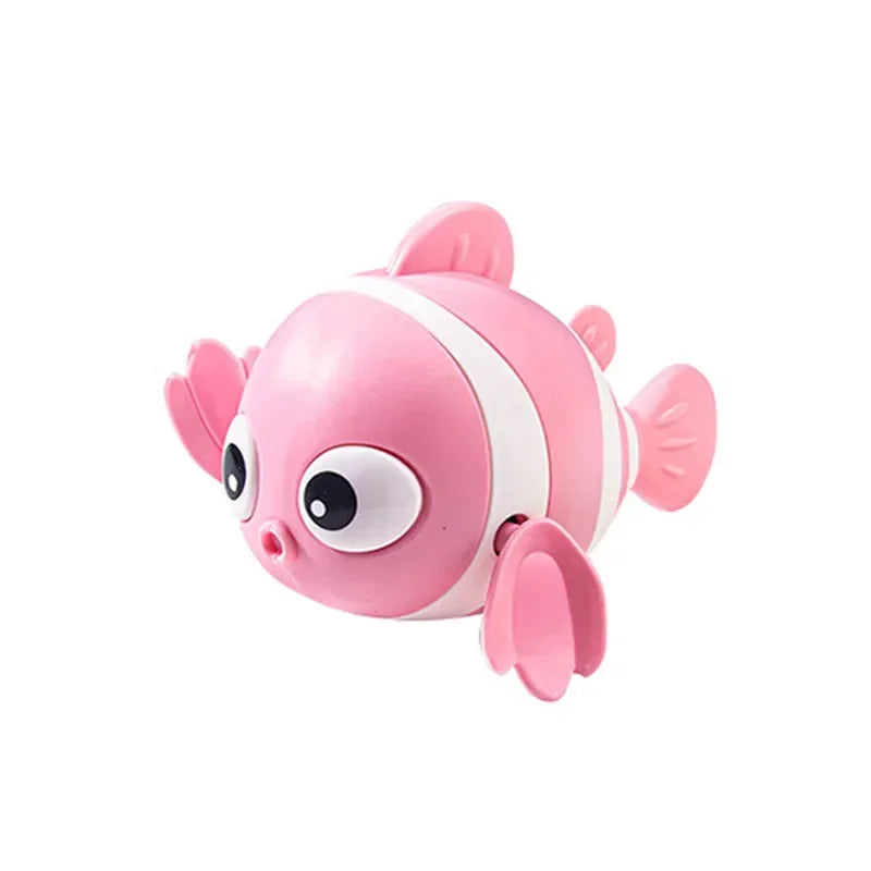 Pink toy fish with a white stripe on a white background