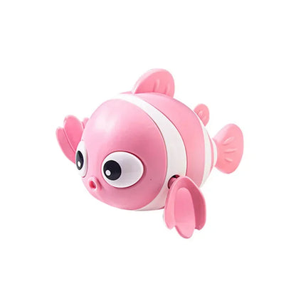 Pink toy fish with a white stripe on a white background