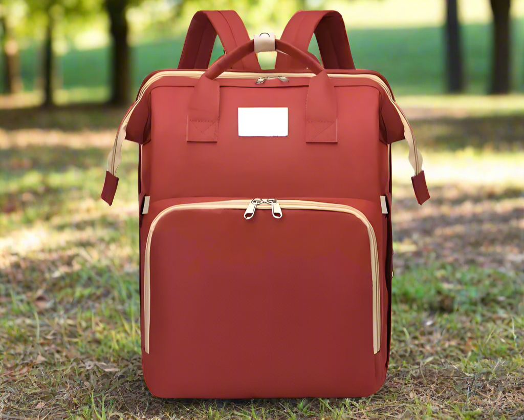 Trekaroo backpack in burnt orange, displayed with all compartments closed to show compact travel form.