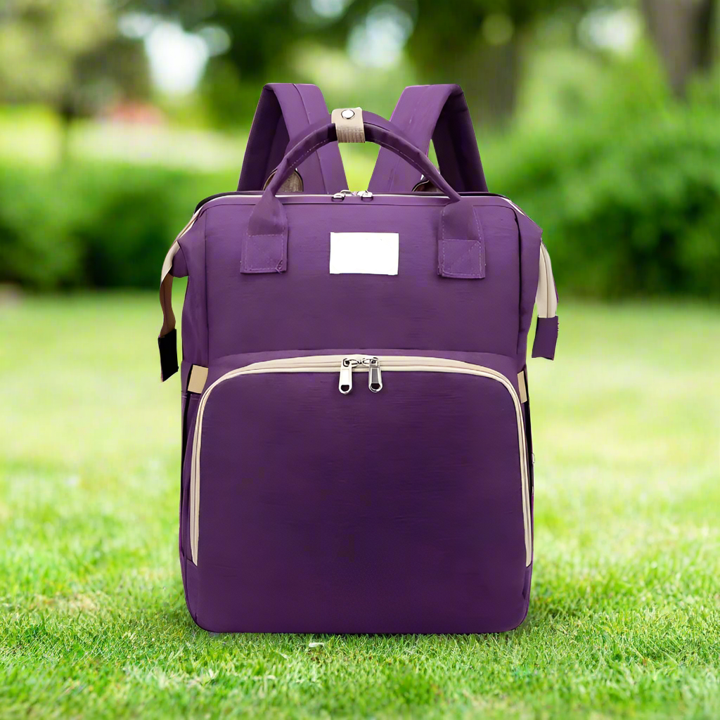Trekaroo backpack in deep purple, displayed from the front to show color and pocket layout.