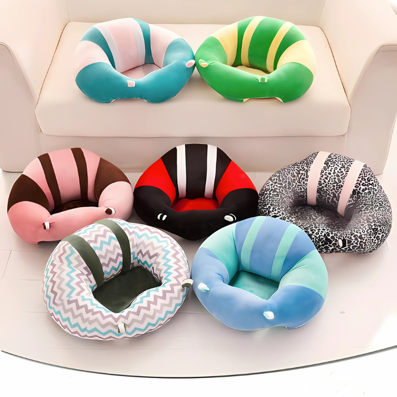 A variety of baby floor plush seats shaped like a caterpillar on a sofa and floor