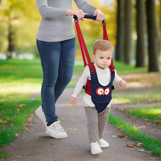 Parent assisting toddler using the blue WalkMate Pro harness, demonstrating safe first steps and comfortable support.