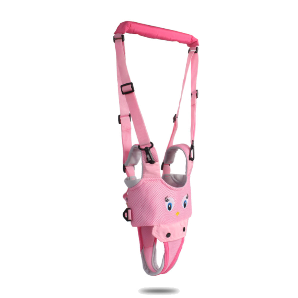 Pink baby walking harness hanging showing adjustable straps and secure buckles.
