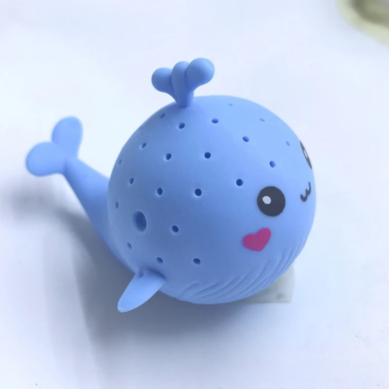Blue whale-shaped product with a face on a white background