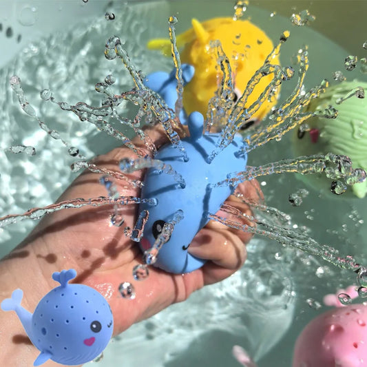 Hand holding a blue bath toy with water splashes and bubbles in the background