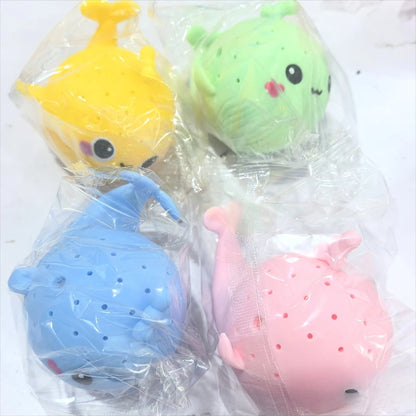 Four colorful silicone tea infusers in clear packaging on a white background