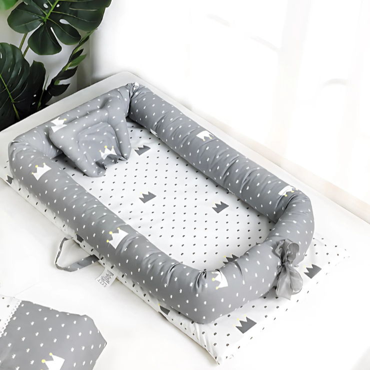 ZippyNap foldable travel crib fully set up, showing soft cotton fabric and tall safety rails.