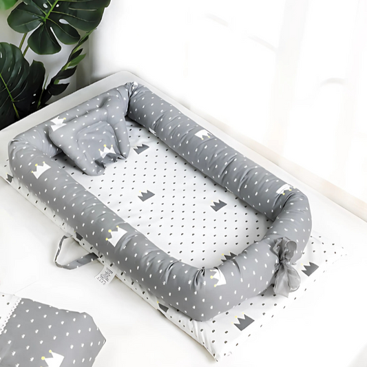 ZippyNap foldable travel crib fully set up, showing soft cotton fabric and tall safety rails.