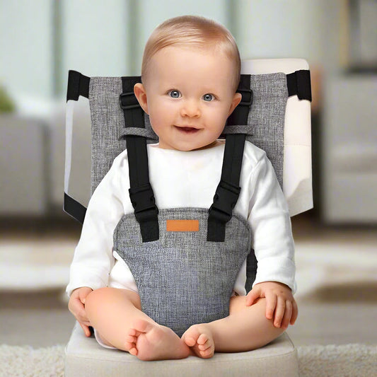 Child safely seated and strapped in the MeToo High Chair attached to a regular dining chair.